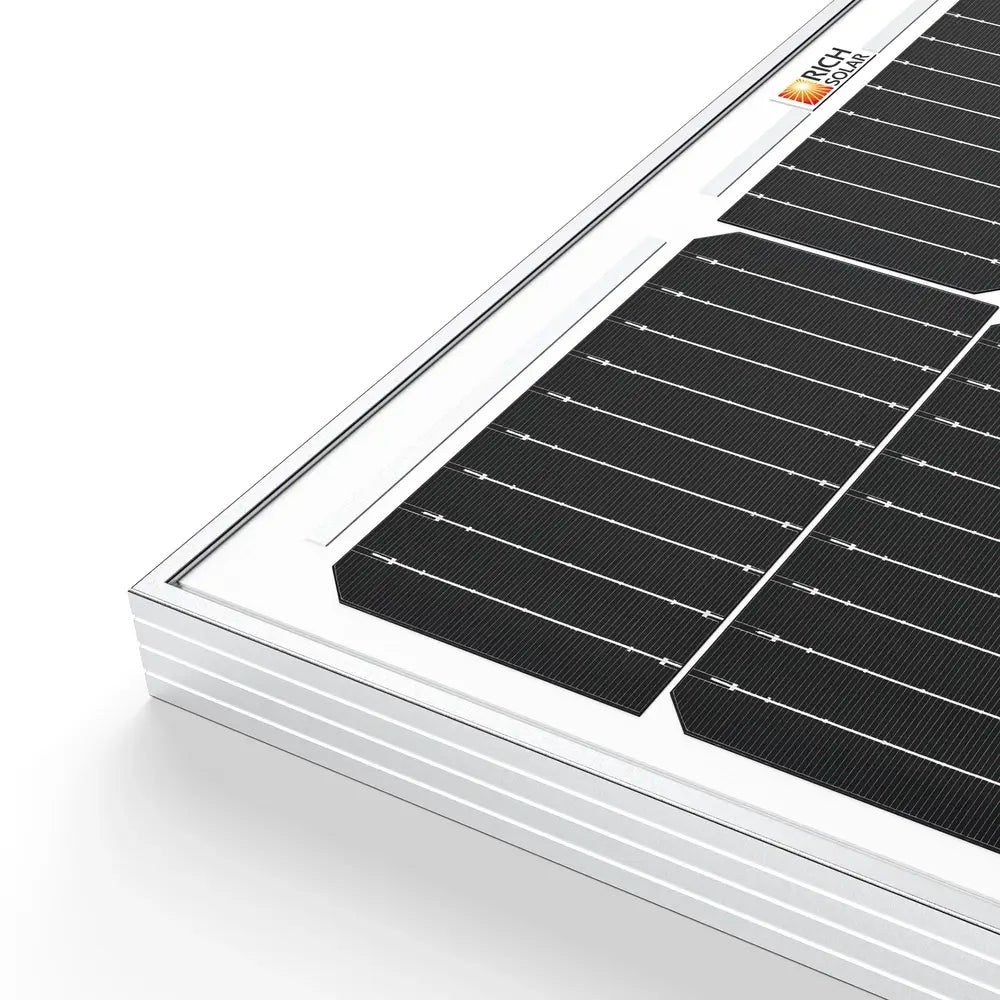 Close-up macro detail of the silver anodized aluminum frame corner and monocrystalline solar cells on a Rich Solar MEGA 100 panel.
