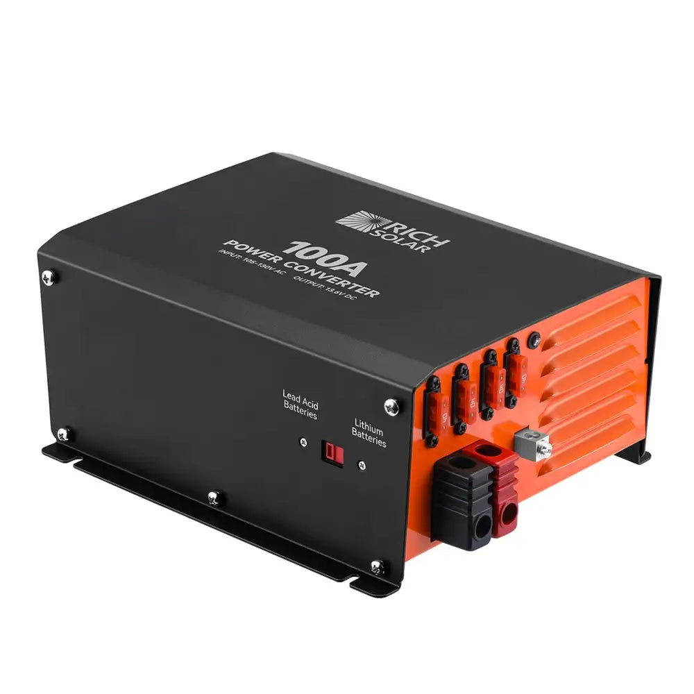 Isometric view of the Rich Solar 100A smart battery charger and power converter showing the dual lithium/lead-acid selector switch and fused DC terminal side.