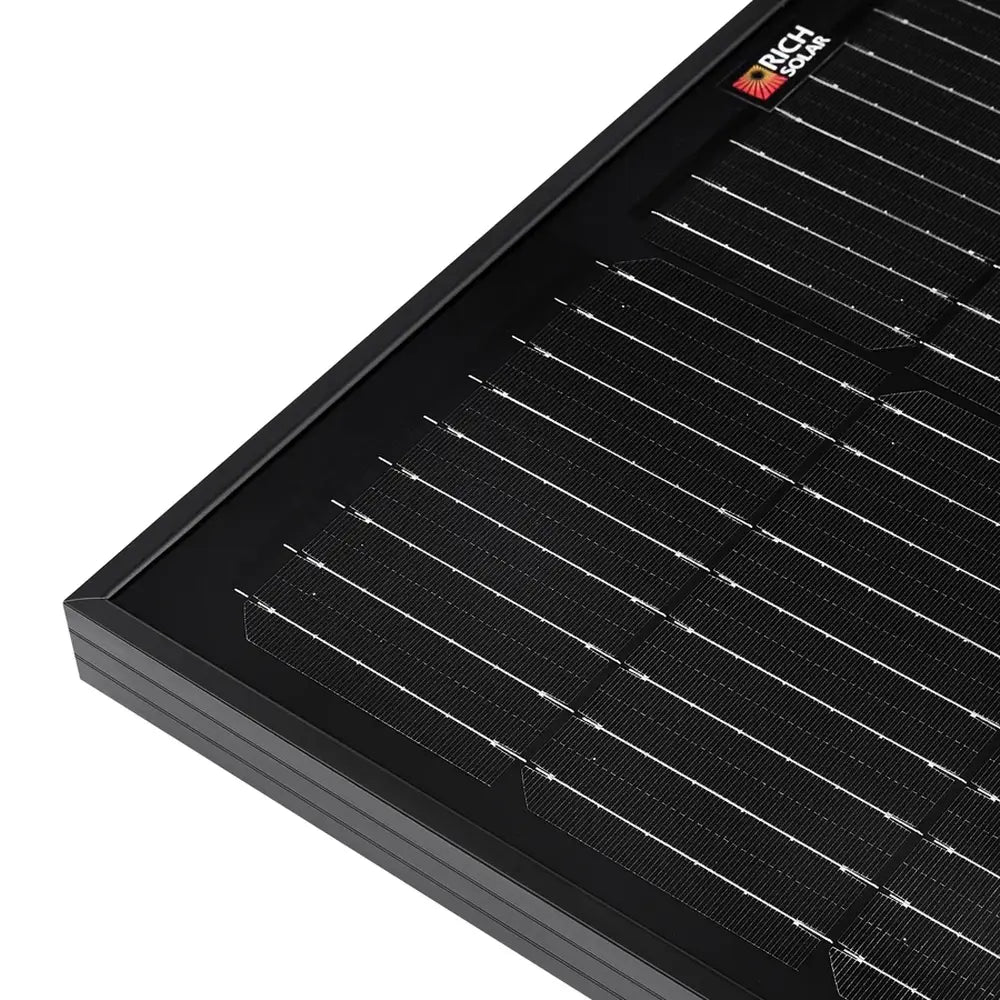 Extreme close-up of a high-efficiency monocrystalline solar cell grid on a Rich Solar ONYX all-black 100W panel.