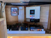 Rich Solar NOVA 6500S hybrid inverter installed in a custom wooden cabinet and connected to four 12.8V 280Ah LiFePO4 lithium batteries.