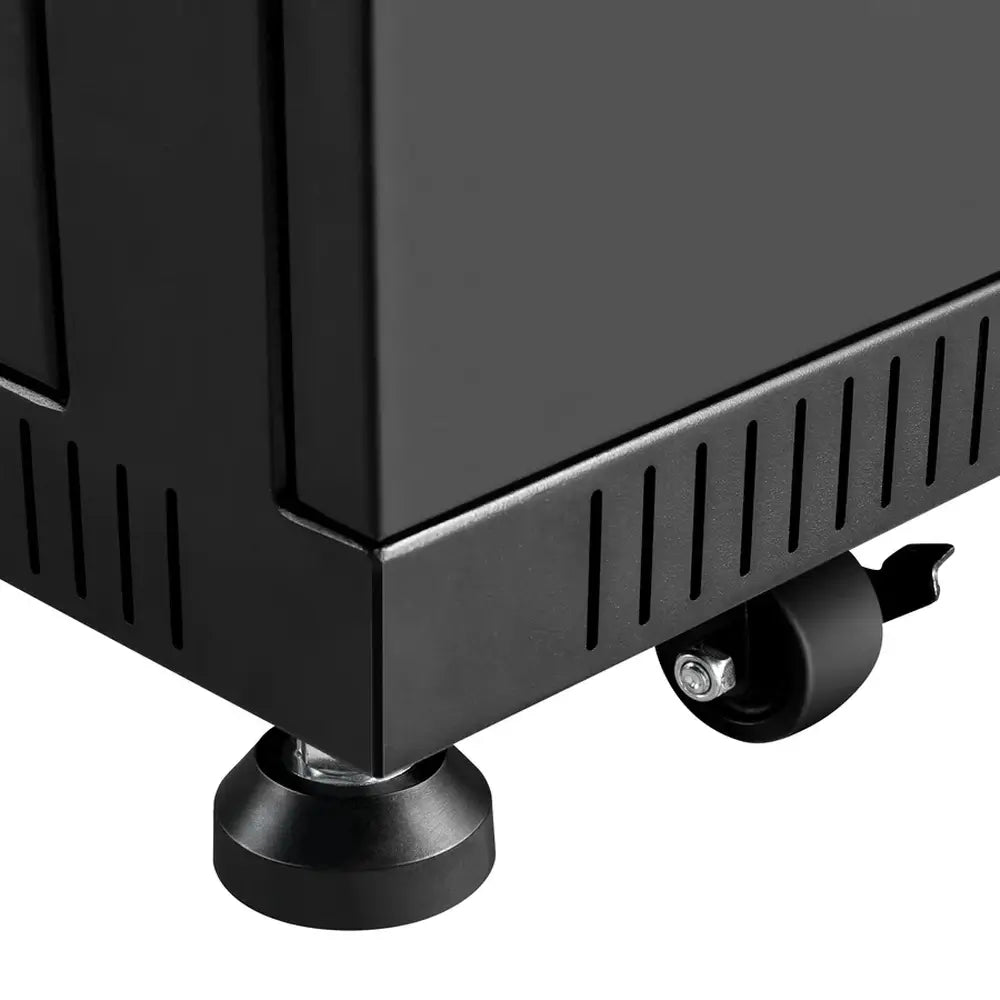 Close-up of the heavy-duty caster wheel and adjustable leveling foot on the base of the Rich Solar server rack battery cabinet.