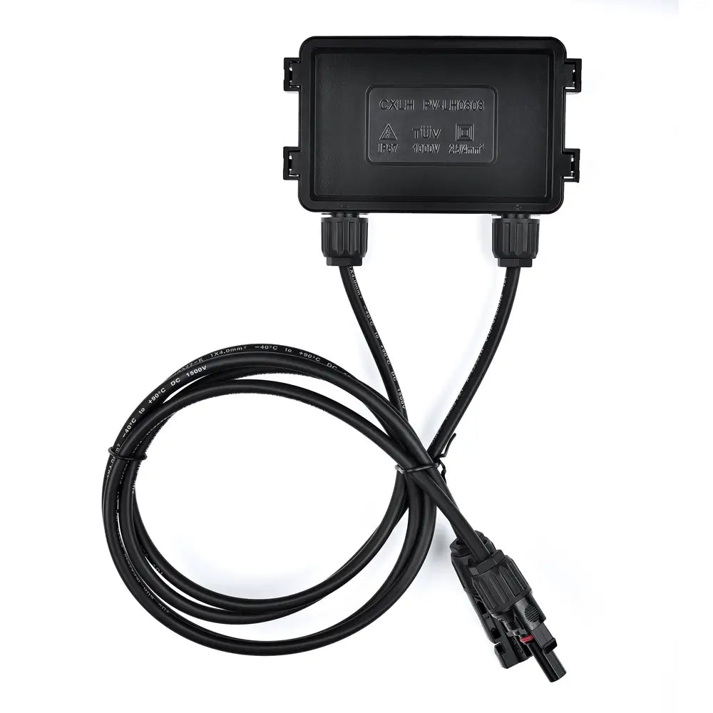 Close-up of the IP67 waterproof junction box and coiled output cables with solar connectors on a Rich Solar panel.