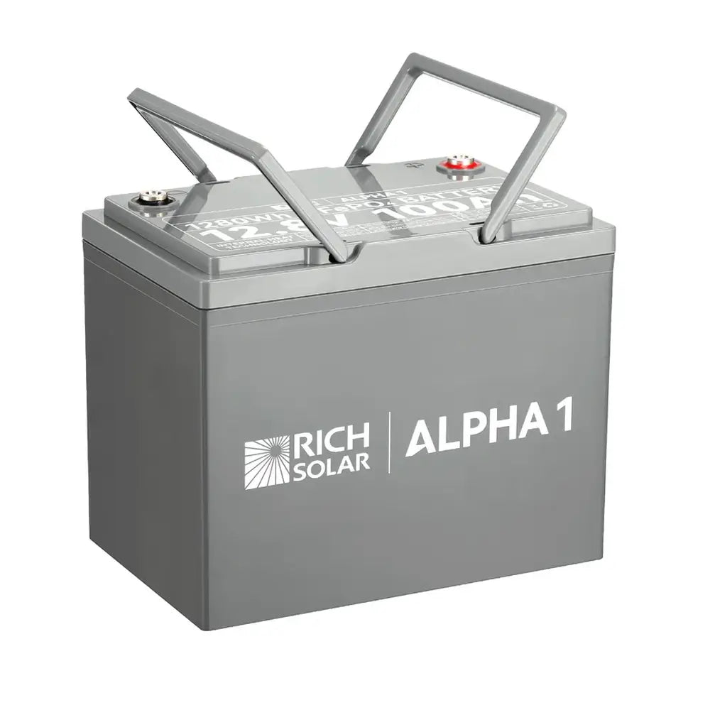 Rich Solar ALPHA 1 100Ah LiFePO4 solar battery with its integrated dual gray carrying handles flipped up for portability.