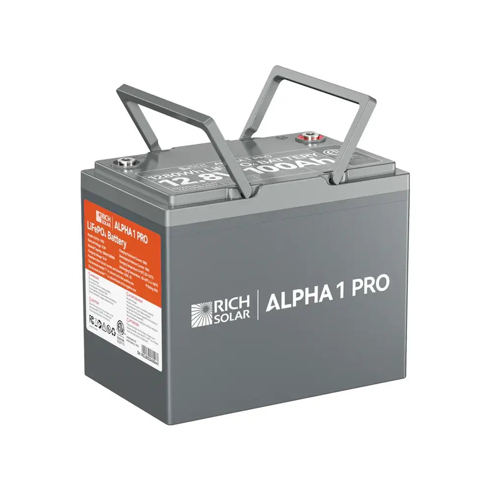 Studio shot of the Rich Solar ALPHA 1 PRO 12.8V 100Ah lithium iron phosphate battery on a white background with its dual built-in carrying handles flipped up for easy transport.