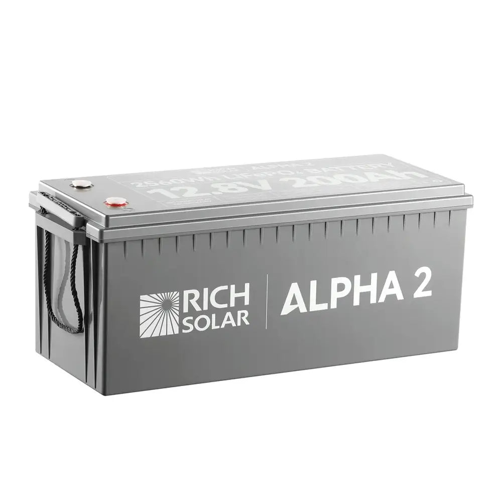 Side angle view of the grey Rich Solar Alpha 2 deep cycle lithium battery housing showing the prominent white Rich Solar logo branding and durable casing design.