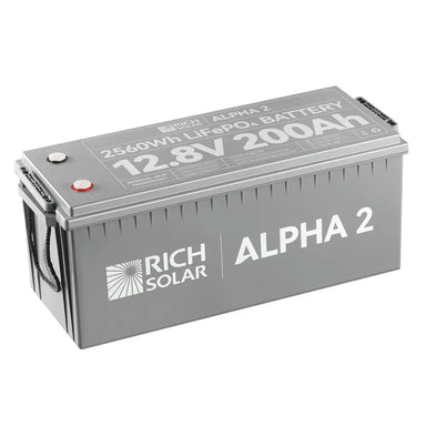 Top-down angle of the Rich Solar Alpha 2 12.8V 200Ah LiFePO4 battery showing printed technical specifications, terminal placements, and product ratings on the lid.