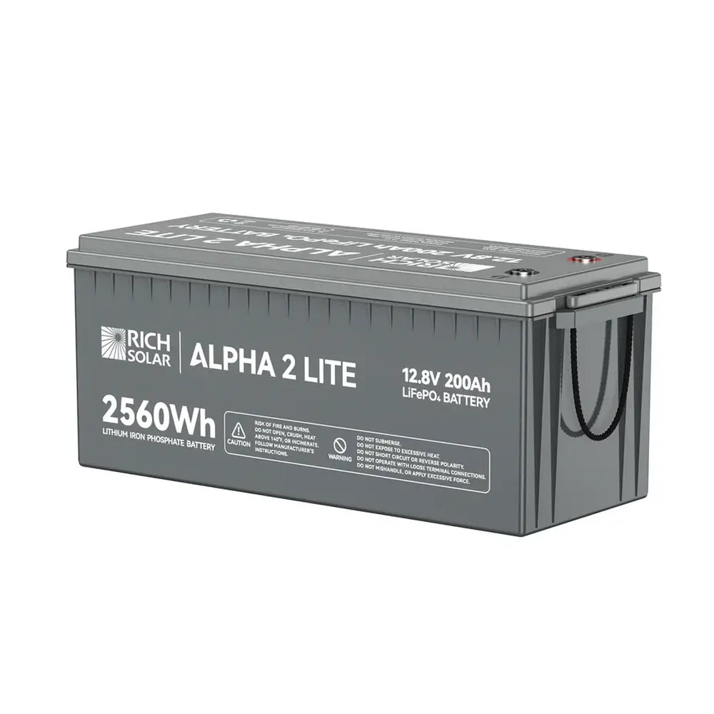 Back-angle studio view of the Rich Solar ALPHA 2 LITE 12V 200Ah LiFePO4 battery displaying its 2560Wh capacity text, technical specifications, and safety warning label print.