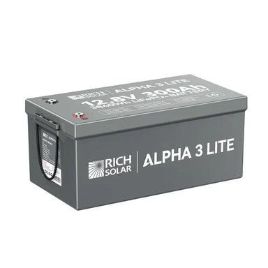 Angled front and top view of the Rich Solar ALPHA 3 LITE 12.8V 300Ah LiFePO4 battery showing the grey casing, brand logo, and terminal positions.