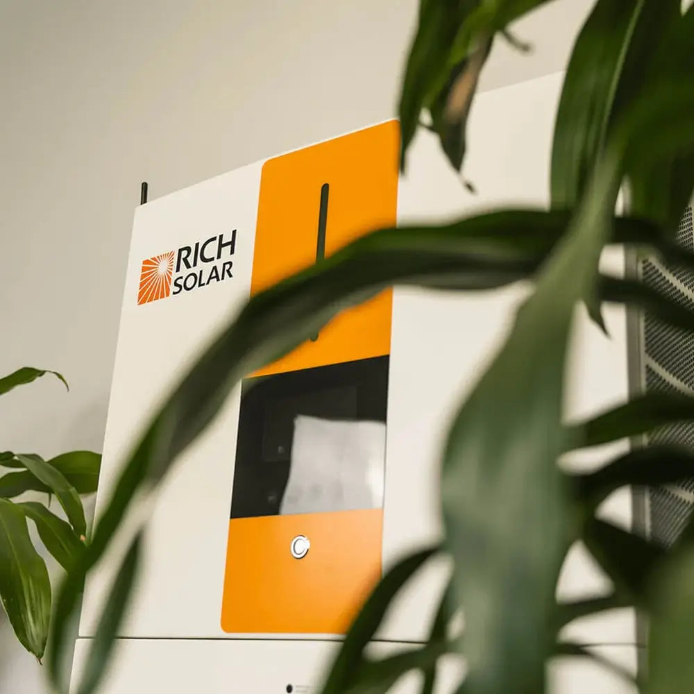 Close-up details of the Rich Solar RS-A10 ESS hybrid solar inverter face with digital status screen and signature orange stripe.