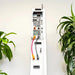 Side connection profile of a wall-installed Rich Solar RS-A10 ESS showing heavy-duty red and black DC battery cables linking the stacked components.