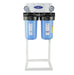 Dual canister Crystal Quest alkalizing water filtration system on a floor stand with dual pressure gauges.