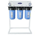 3-stage Crystal Quest alkalizing water filtration system on a white floor stand with blue filter housings.