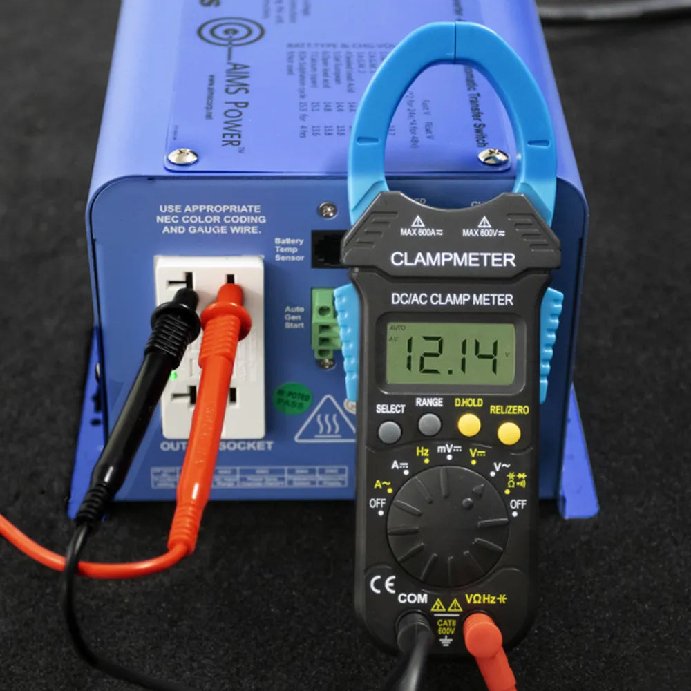 AIMS Power clamp meter connected to blue power inverter outlet showing 12.14V digital reading.