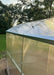 Close-up of the roof line and corner trim assembly on a GreenhouseToGrow Magnolia 10x32.5 heavy-duty greenhouse kit.