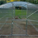 Front view of the Magnolia 10x6.5 Greenhouse Kit entrance showcasing the clear polycarbonate walls and internal structural supports.