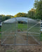 Front-facing view of the Magnolia 10x13 Greenhouse Kit featuring the split-door design and transparent, UV-protected panels.