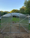 Front facade of the GreenhouseToGrow Magnolia 10x39 Greenhouse Kit featuring the signature split Dutch door and clear polycarbonate panels.