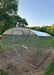 Side profile of a 32.5-foot long GreenhouseToGrow Magnolia polycarbonate greenhouse kit fully assembled on a prepared dirt base.