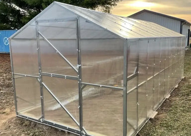Exterior front gable view of the GreenhouseToGrow Daisy 8.3'x13' greenhouse showing the durable polycarbonate glazing and frame.