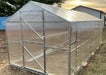 Heavy-duty GreenhouseToGrow Daisy 8.3'x32.5' polycarbonate greenhouse showcasing end-wall bracing and clear paneling.