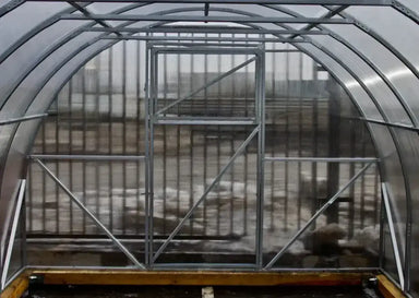 Interior view of the GreenhouseToGrow Camellia 10x13 Greenhouse Kit showing the heavy-duty galvanized steel frame and translucent polycarbonate panels.