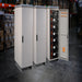 Multiple AIMS Power lithium battery cabinets in warehouse, including one open 230V cabinet with stacked LiFePO4 modules.
