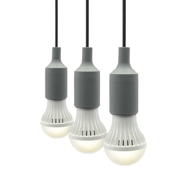 Three Lion Energy LED light bulbs hanging in a row with gray sockets and black cords on a white background
