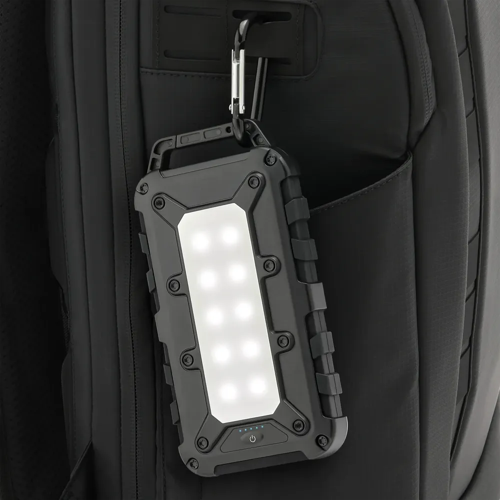 Lion Energy Lion Cub power bank with built-in LED light on backpack