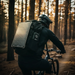 Cyclist carrying Lion Energy solar panel and Eclipse Mag power bank