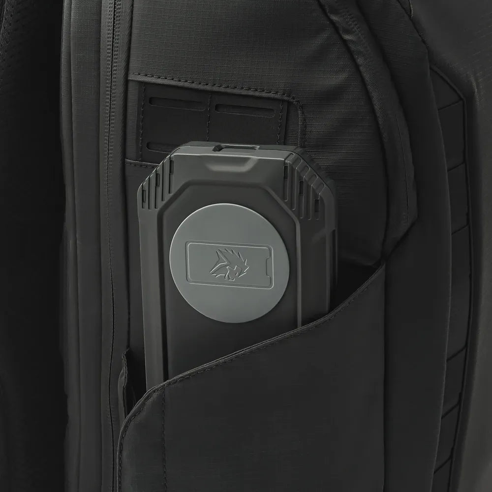 Close-up of Lion Energy Eclipse Mag power bank in backpack pocket