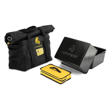 Complete Lion Energy Mil-Spec EMP Bag kit featuring black roll-top protective bag, black metal shielding box, and yellow zip accessory pouch arranged together on a light gray background