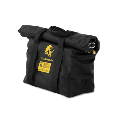 Black Lion Energy Mil-Spec EMP roll-top protective bag with dual carry straps, yellow Lion Energy logo label, and side D-ring, displayed upright on a light gray studio background