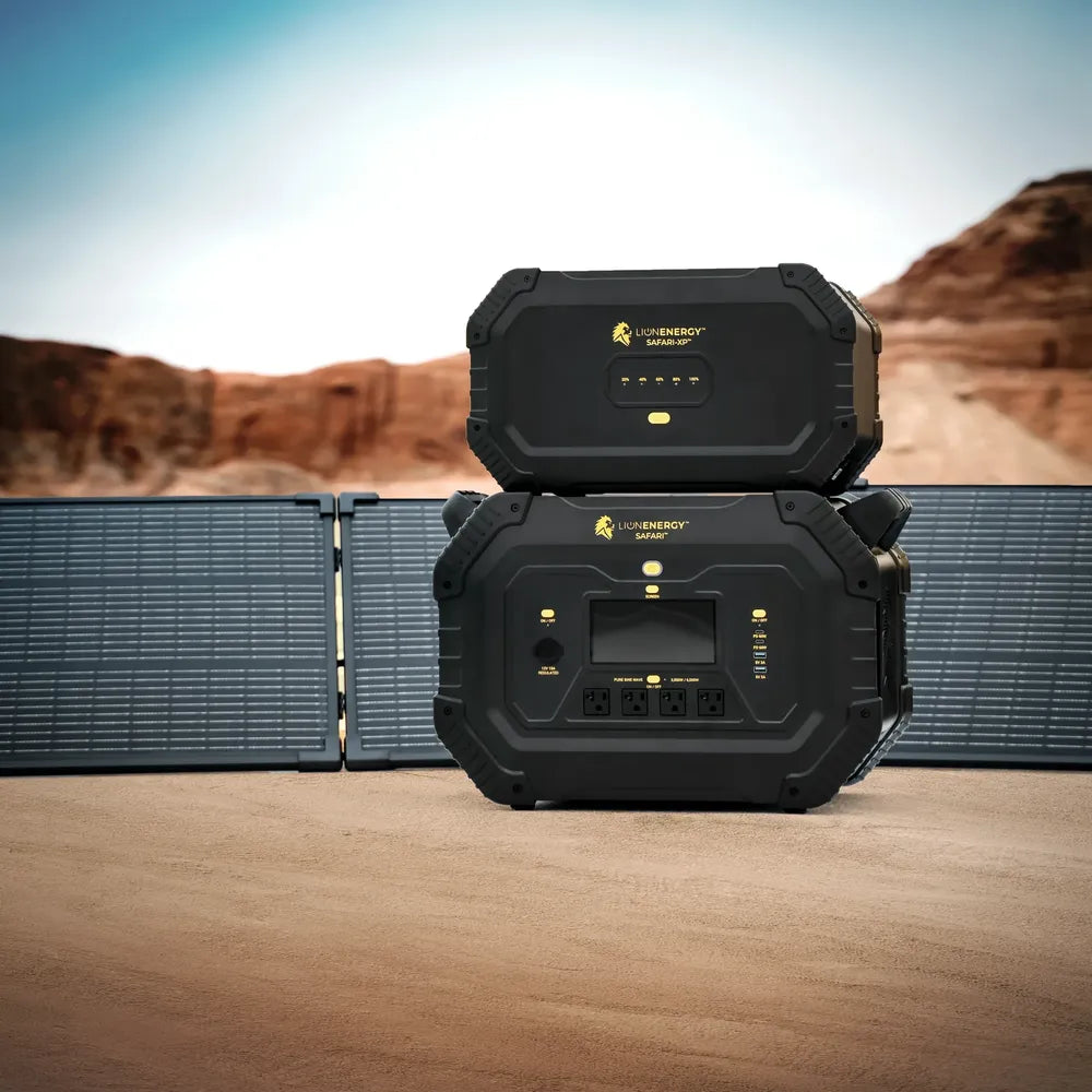 Lion Energy Safari XP 2688Wh expansion battery stacked above Safari power station with folding solar panels in a desert landscape