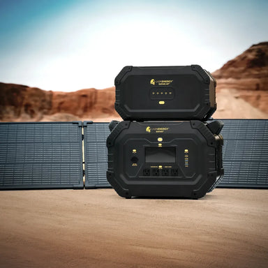 Lion Energy Safari XP 2688Wh expansion battery stacked above Safari power station with folding solar panels in a desert landscape