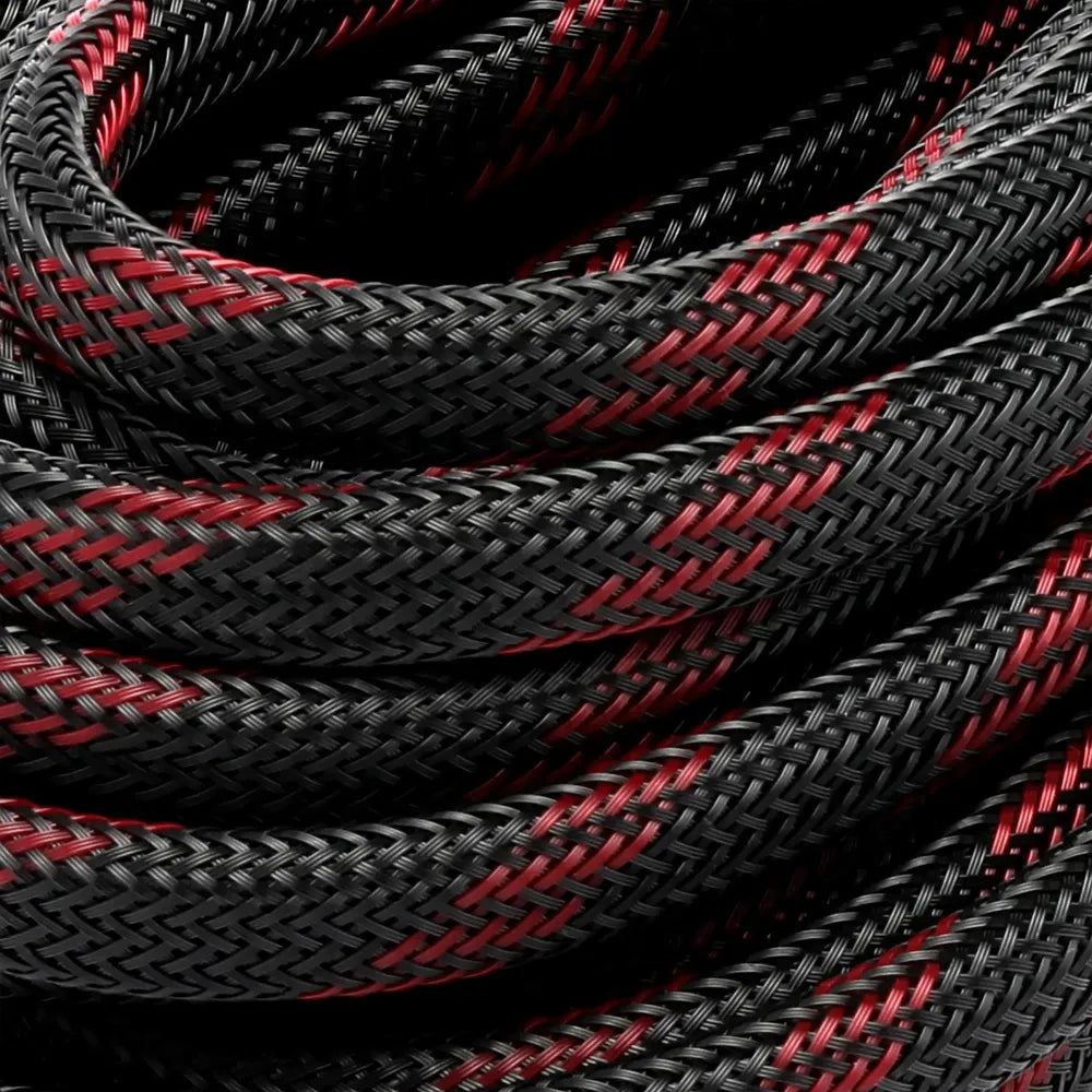 Detailed macro view of the braided black and red outer jacket on the Lion Energy solar extension cable, highlighting durable woven construction