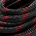 Detailed macro view of the braided black and red outer jacket on the Lion Energy solar extension cable, highlighting durable woven construction