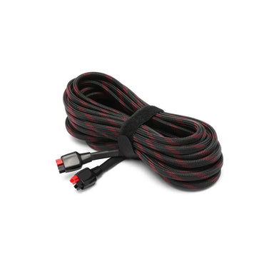 Coiled Lion Energy 25-foot solar extension cable secured with hook-and-loop strap, featuring heavy-duty braided insulation and quick-connect ends