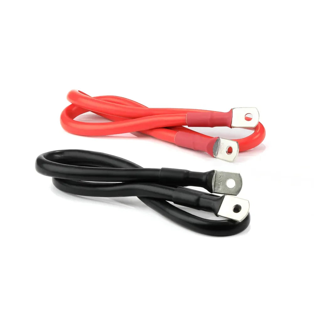 Heavy-duty red and black battery connection cables with metal ring terminals for the Lion Energy Savanna IV inverter, shown in a clean studio close-up