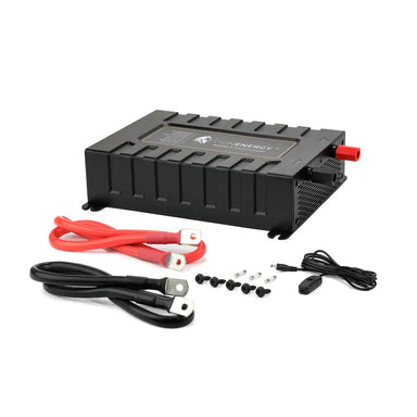 Angled studio view of the Lion Energy Savanna IV 2000W inverter, a black rectangular pure sine wave power inverter with red positive and black negative battery terminals, vented side panel, and mounting feet on a light gray background