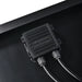 Close-up of the IP65 waterproof junction box on the back of the Rich Solar 100W portable solar panel, showcasing the secure, weather-resistant dual cable output.