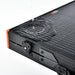 Water pouring over a folded Rich Solar MEGA 100W portable solar panel to demonstrate its waterproof and weather-resistant construction.