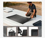 Step-by-step installation process of a Rich Solar 200W flexible solar panel onto an RV roof using silicone adhesive backing.