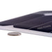 Close-up of ultra-thin AIMS Power flexible solar panel edge beside a coin, highlighting low-profile lightweight construction and bendable photovoltaic surface.