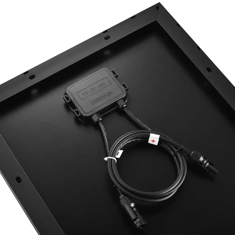 Close-up corner view of the Rich Solar MEGA 130W Slim panel showcasing the crisp orange brand logo against the premium black frame.