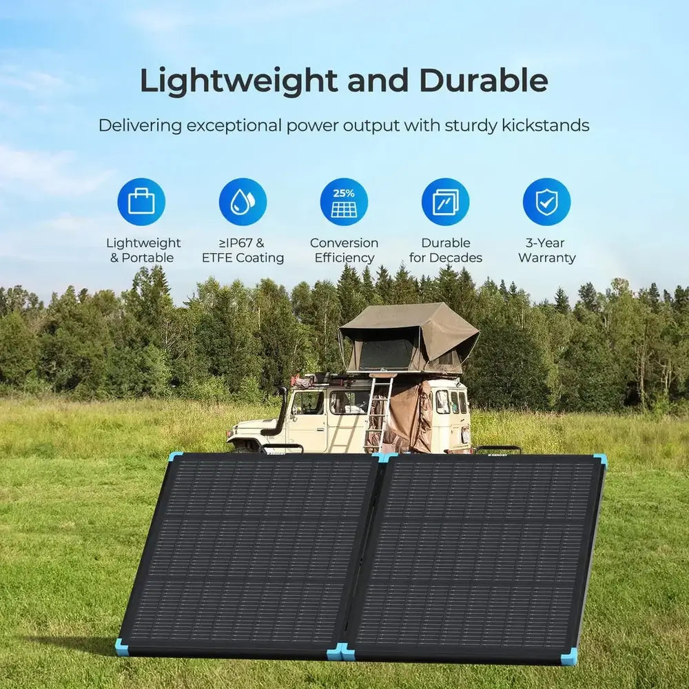 Renogy lightweight and durable portable solar suitcase deployed in a grassy field with an overlanding camping truck.