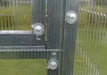 Close-up of specialized rubber-capped washers and screws used to weather-seal polycarbonate panels to the Daisy greenhouse frame.