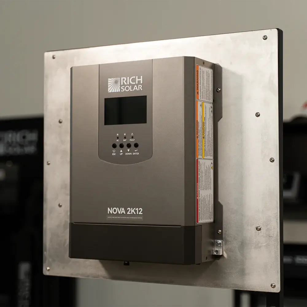 Rich Solar NOVA 2K12 2000W inverter with built-in transfer switch securely flush-mounted to an aluminum backing plate for an off-grid solar energy setup.