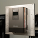 Rich Solar NOVA 2K12 2000W inverter with built-in transfer switch securely flush-mounted to an aluminum backing plate for an off-grid solar energy setup.