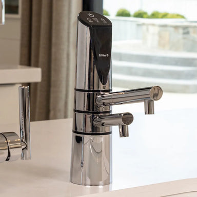 Close-up of chrome AlkaViva Delphi H2 ionizer faucet by sink