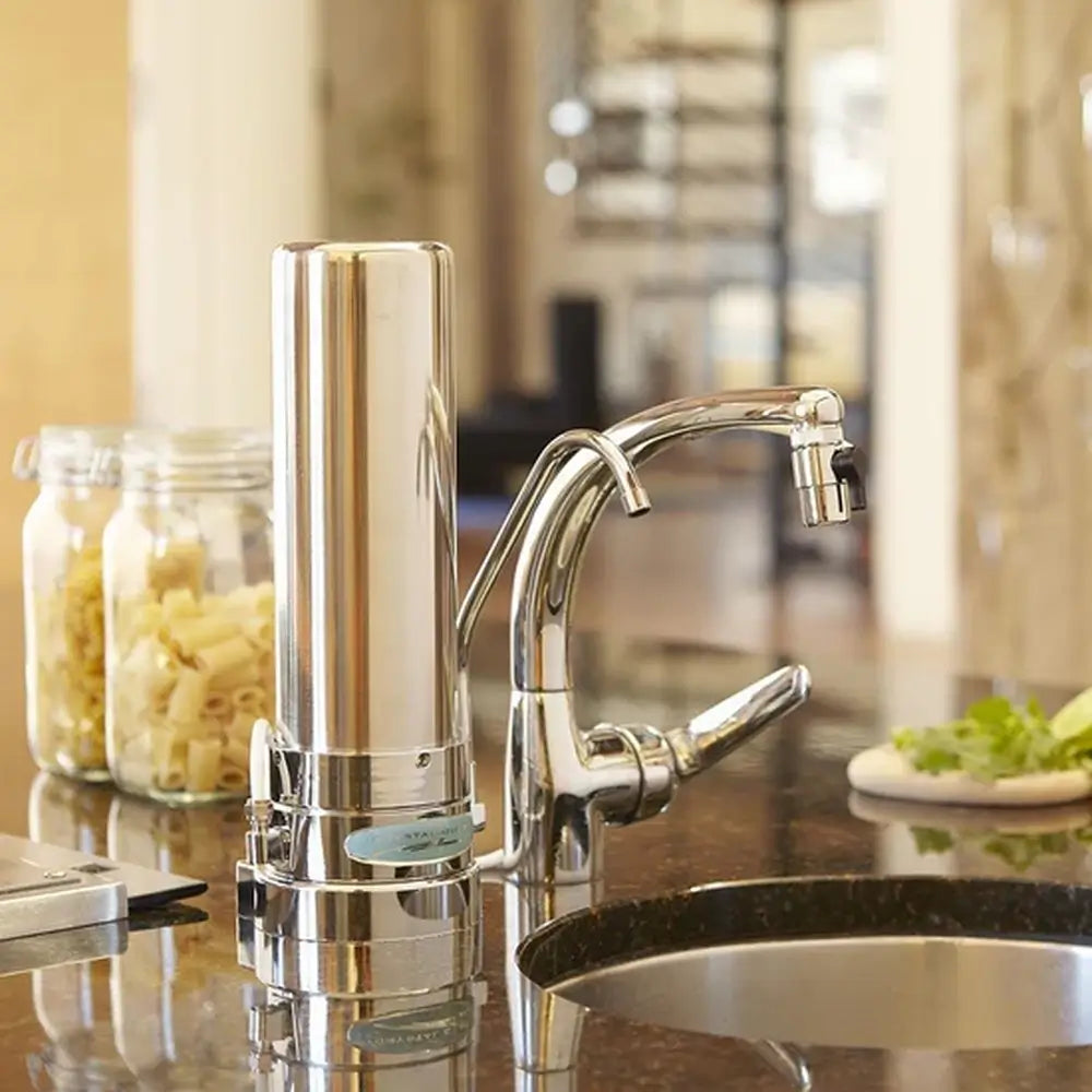 Modern Stainless Steel Crystal Quest Nitrate SMART Countertop Water Filter System featuring a sleek single cartridge design in a contemporary kitchen setting.